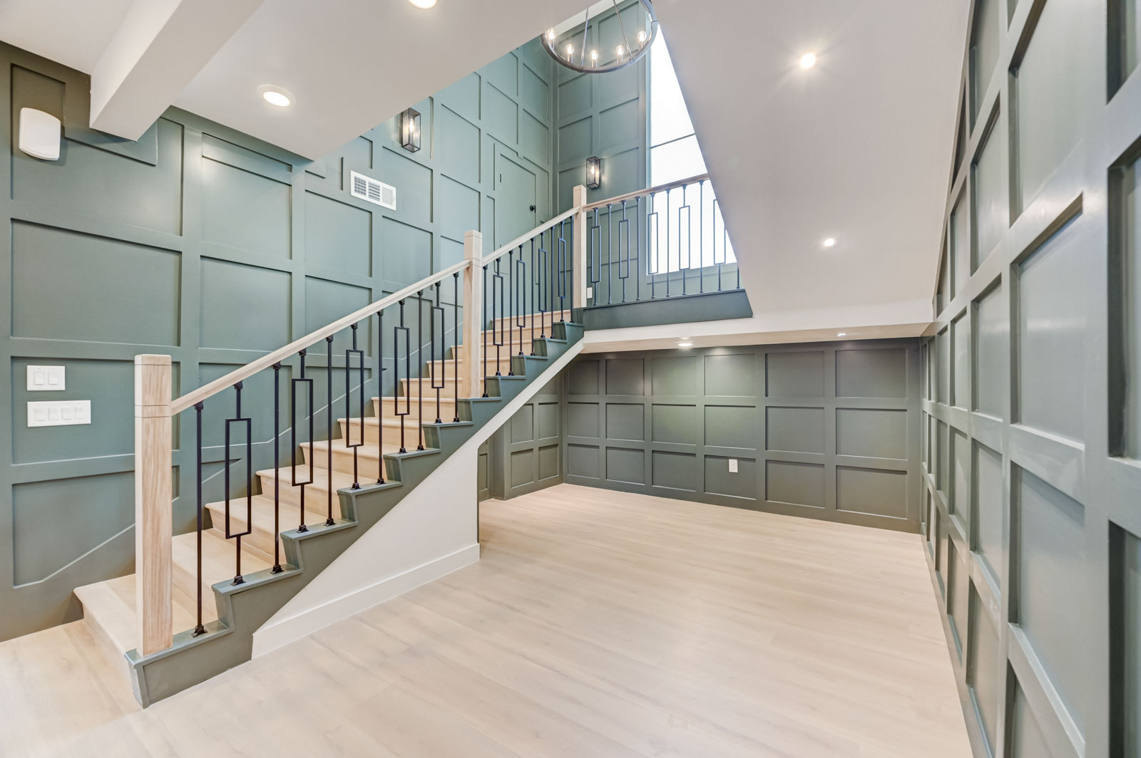Staircase renovation with paneled accent wall
