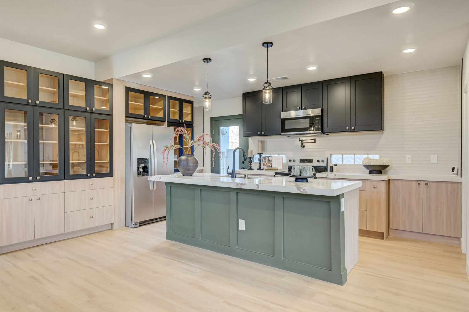 Kitchen renovation with glass-front cabinetry