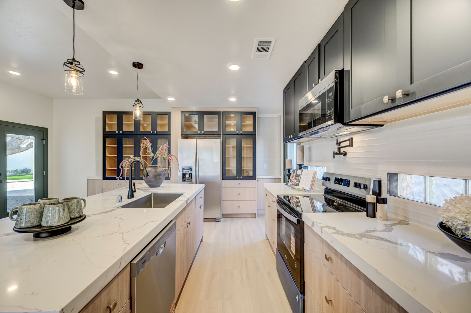 Galley kitchen renovation with two-tone cabinetry
