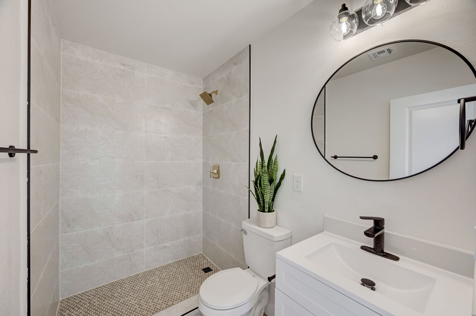 Bathroom renovation with walk-in tiled shower