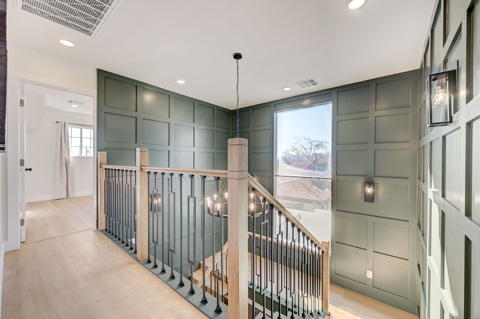 Upstairs landing with paneled accent wall